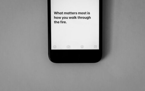 Inspirational quote displayed on a smartphone screen with a monochrome aesthetic.