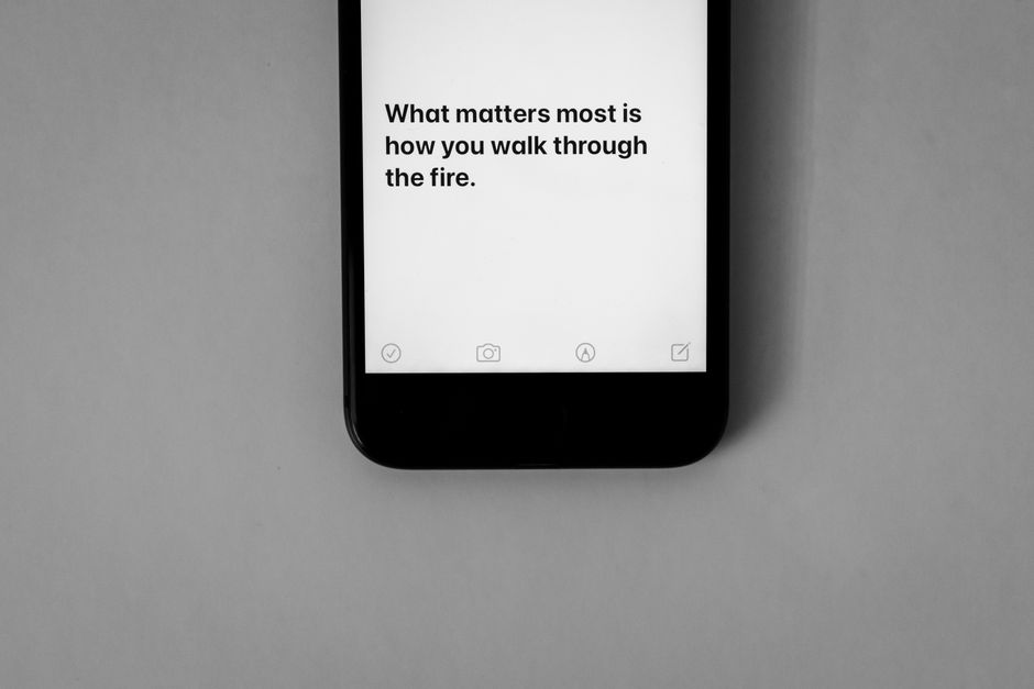 Inspirational quote displayed on a smartphone screen with a monochrome aesthetic.